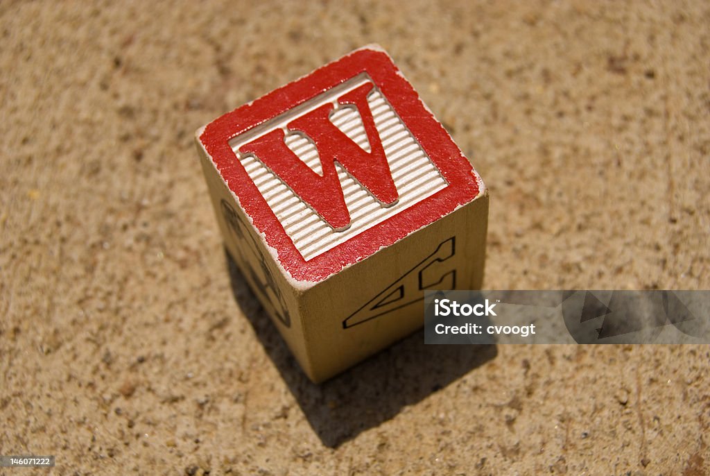 W Cube Wooden toy cube with red letter ""W"" Alphabet Stock Photo