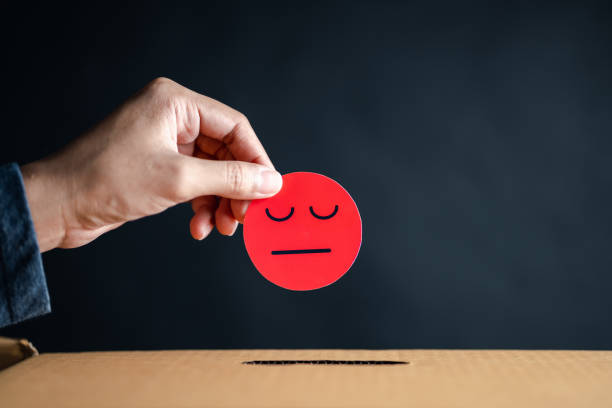 istock Customer Experience dissatisfied choose bad face emoticon paper cut drop to comment box. Bad review, bad service dislike poor quality, low rating, not good service. 1460713204