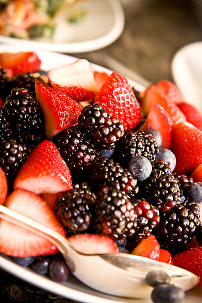 istock Mixed Berry Compote strawberries blueberries blackberries and spoon 146071331