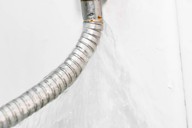 istock water is flowing from a broken shower hose. 1460714298