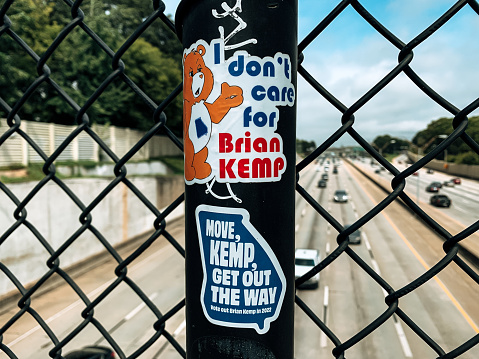 Atlanta, United States – August 18, 2021: Anti Brian Kemp stickers encouraging Georgia voters to vote him out in the next election for Governor
