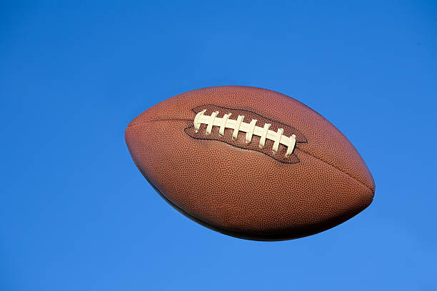 istock Football in flight with clipping path 146071582