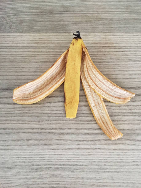 istock Banana peel on the wood table background 1460716560
