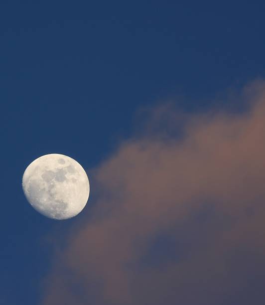 moon on the sunset sky stock photo