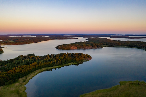Aerial view of sunlit islands of Geta in Aland, serene, summer sunset, in Finland