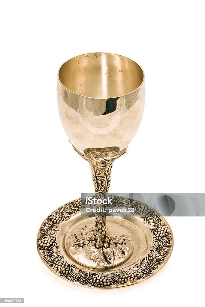 kiddish cup with wine Silver kiddush wine cup and saucer isolated Purim Stock Photo
