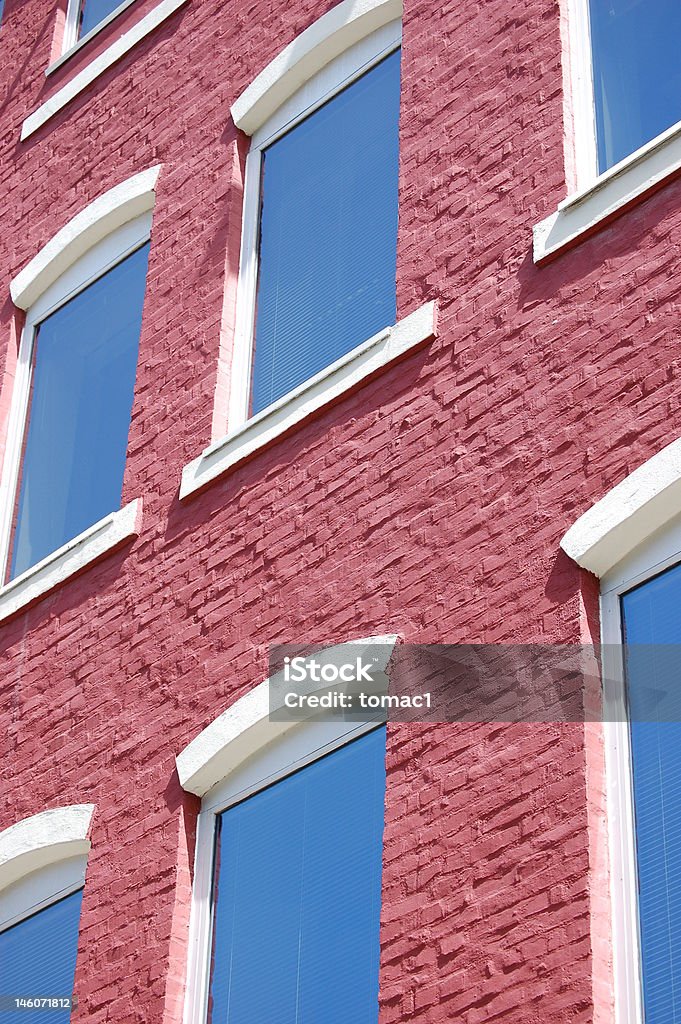 Part of building with windows Old brick building with windows. Apartment Stock Photo