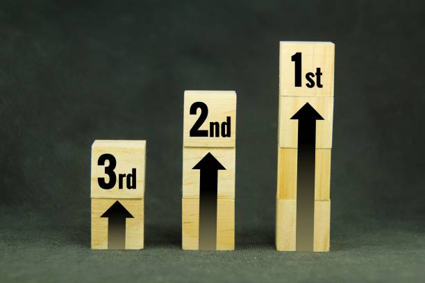 istock wooden cubes with arrows and first place, second place and third place 1460719598