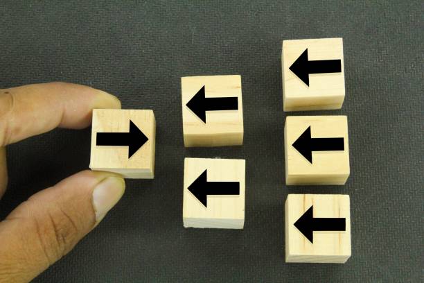 istock wooden cubes with arrows one in a different direction and another .Different thinking, individuality 1460719849