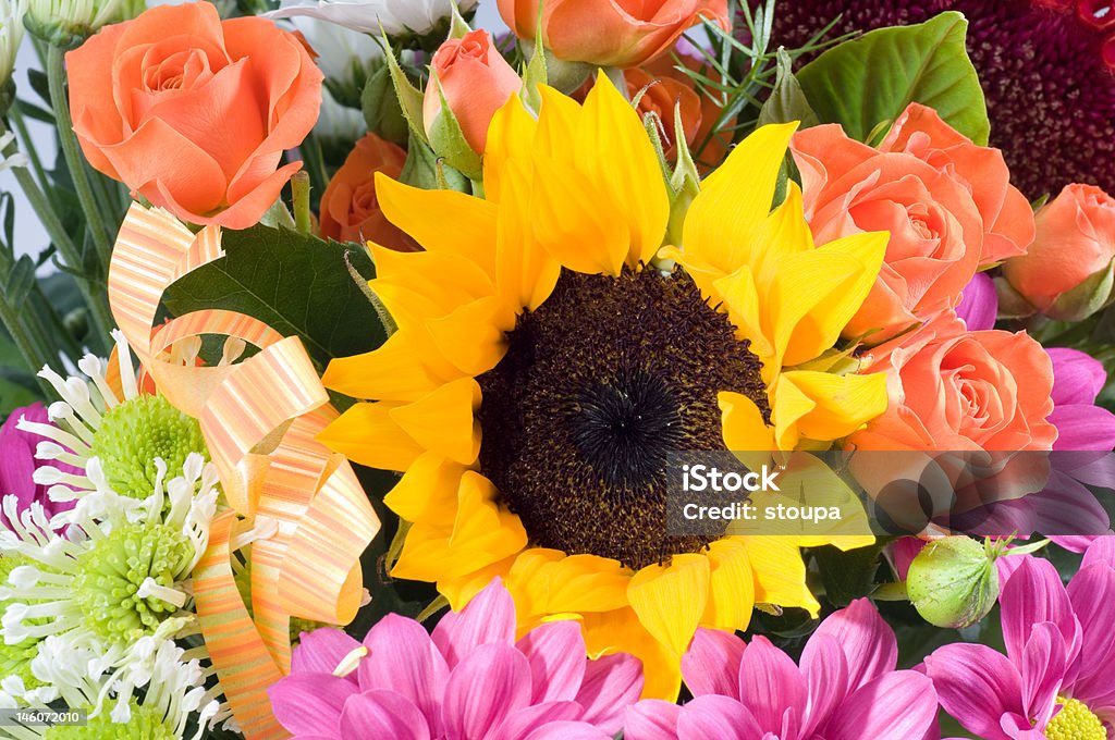 Flower bunch Bunch of various colorful flowers - detail of yellow sunflower and pink roses. Bouquet Stock Photo