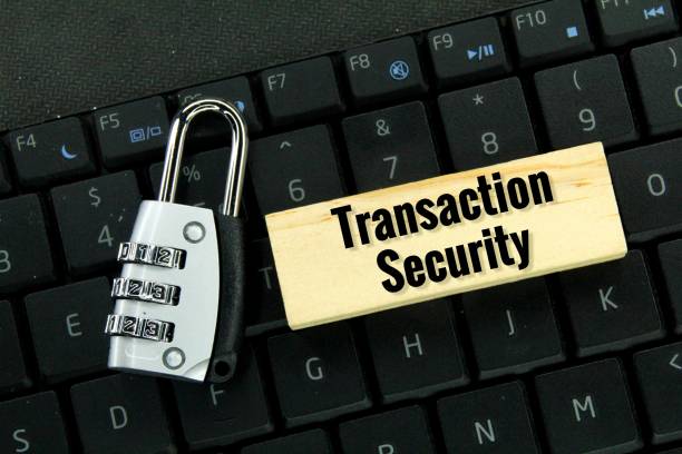 istock laptop keyboard, keys and wooden board with the word transaction security 1460720471