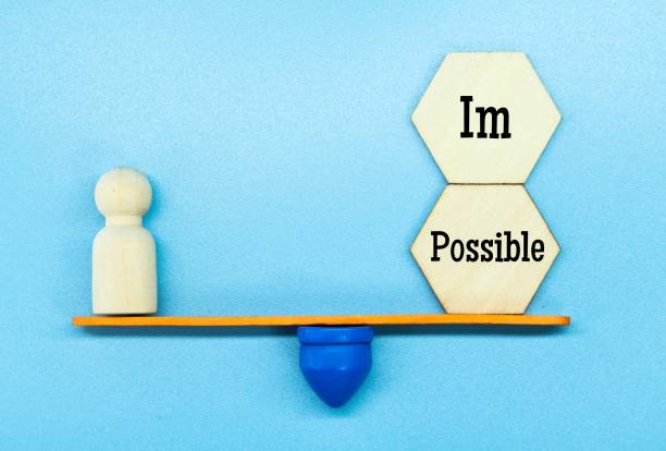 istock peg doll balanced with the word i am Possible 1460720843