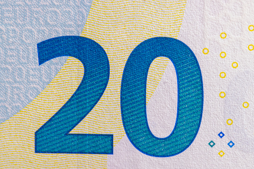 High resolution photograph of  two 100 Euro bills, selective focus.
