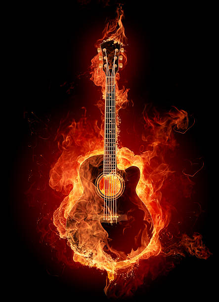 A guitar picture engulfed with fire stock photo