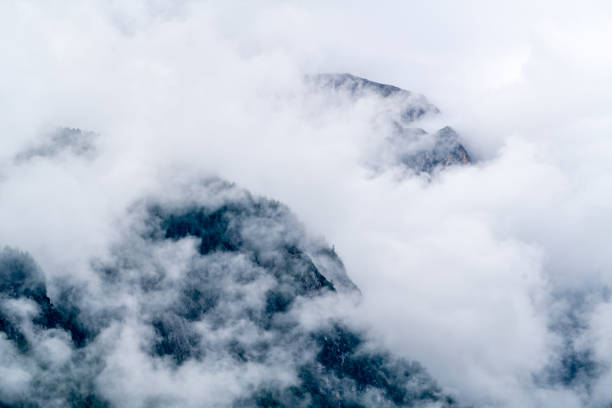 istock Aerial view of mountains surrounded by clouds 1460722233