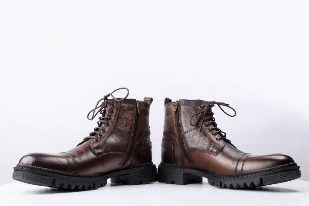 istock A pair of brown colored leather boots on a white background. 1460722697