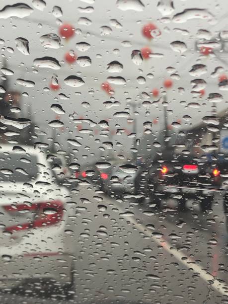 istock Raindrops falling on the car window in grains. 1460722978