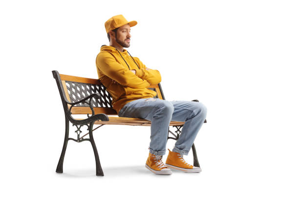 istock Casual guy sitting on a bench and thinking 1460723147