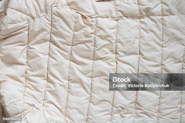 Womens Padded White Soft Jacket As Background Of Soft Light Fabric Stock Photo - Download Image Now