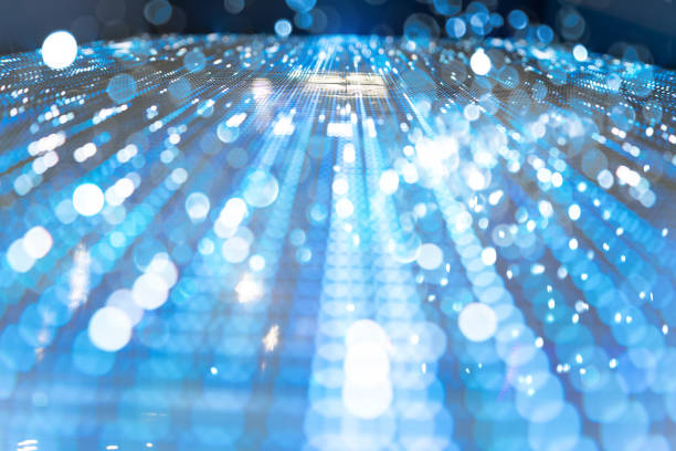istock Blue abstract background of an electronic board with bokeh lights 1460725536