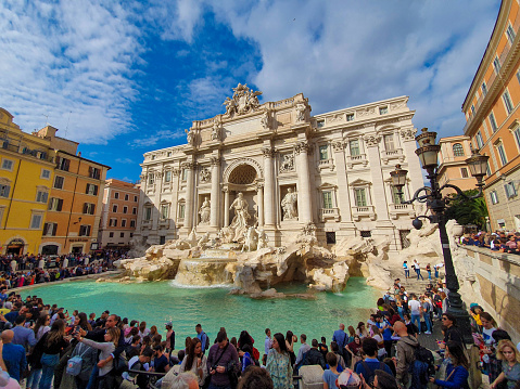Rome, Italy – November 01, 2019: People take selfies in fron of the Trevi Fountain in Rome