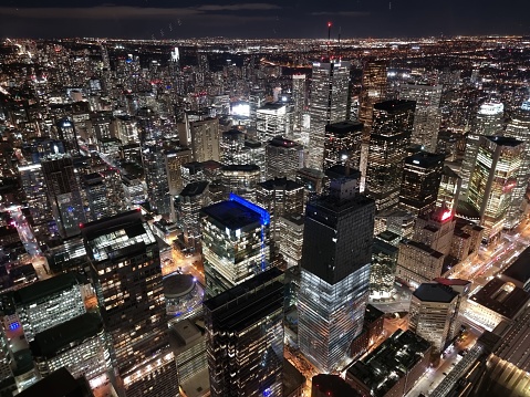 An aerial view of cityscape Toronto surrounded by buildings in night