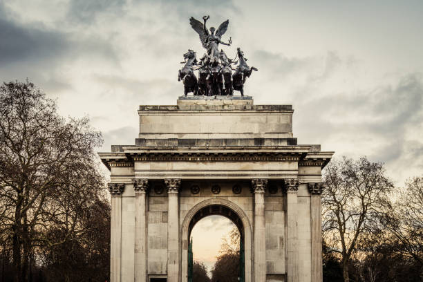 istock Quadriga surrounded by trees in Hyde Park under a cloudy sky in London, the UK 1460726476