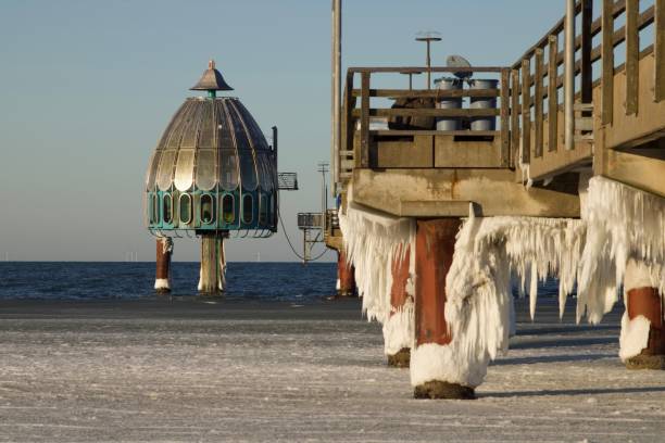 istock Big Diving gondola at the pier Zingst, Germany with icicles on it 1460727065