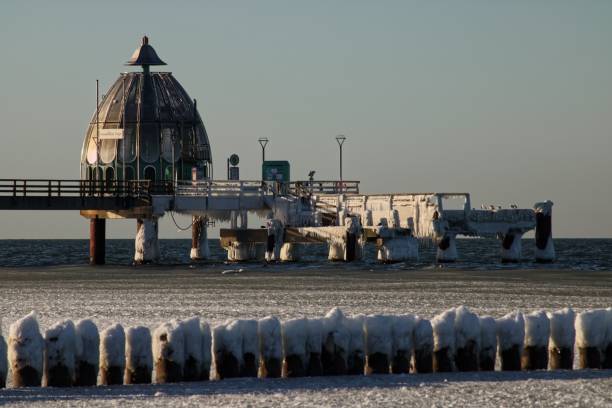 istock Big Diving gondola at the pier Zingst, Germany with icicles on it 1460727070