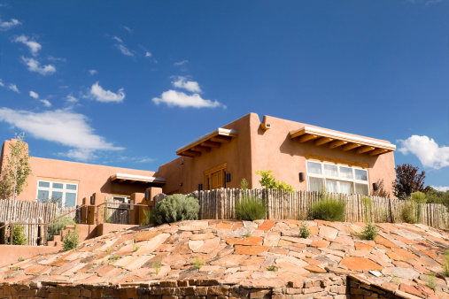 Mission style single family house made of adobe.  Outside Santa Fe, New Mexico, United States.  - See lightbox for more