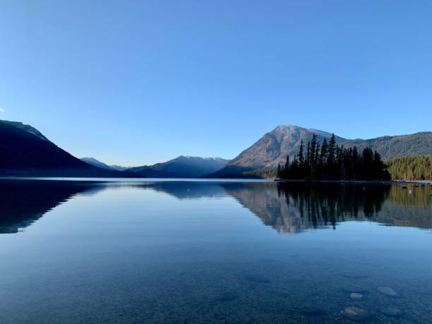 istock Blue sky over clear Lake Wenatchee, Washington State 1460729386