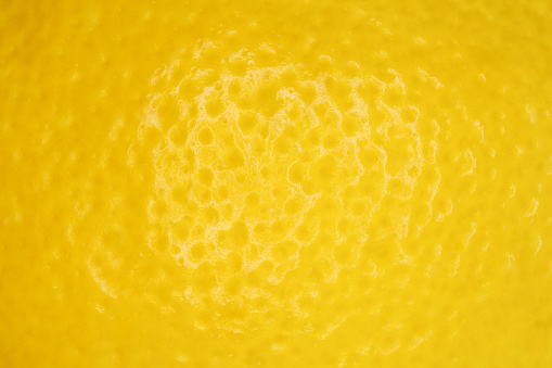 Lemon peel yellow, close-up macro view, full depth of field
