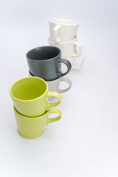 istock set of piled up mugs on a white background with space for text 1460735355