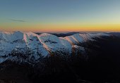 Fagaras mountains covered with snow in golden hour