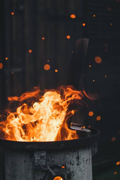 istock Vertical shot of fire flames from a metal pot 1460736839