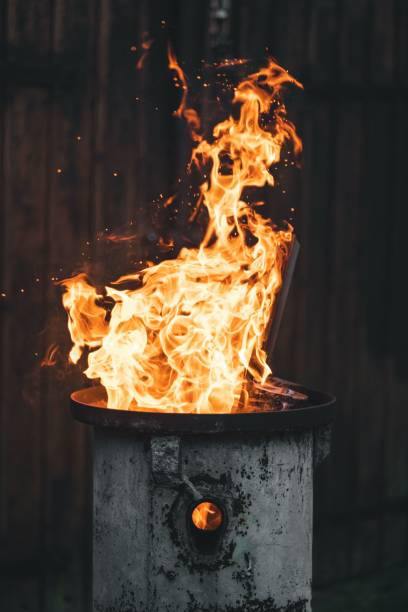 istock Vertical shot of fire flames from a metal pot 1460736844