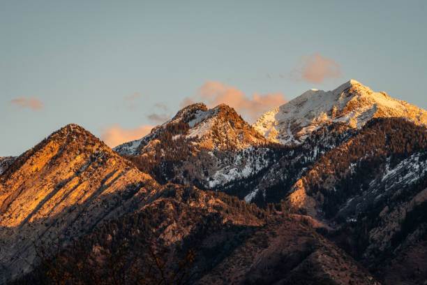 istock Beautiful shot of snowy mountains and cliffs under a bright sky 1460736922