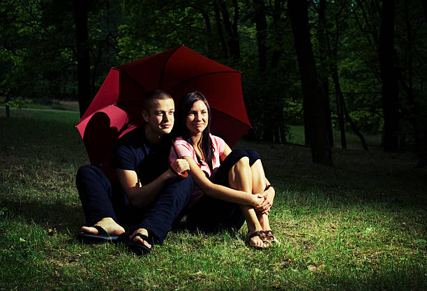 Young couple under umbrella. stock photo