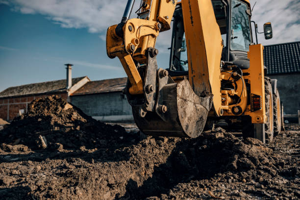 istock Cropped picture of a backhoe digging trench on site. 1460737674