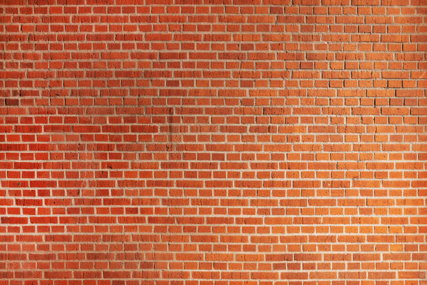 istock Large orange exterior brick wall pattern as urban background 1460737825