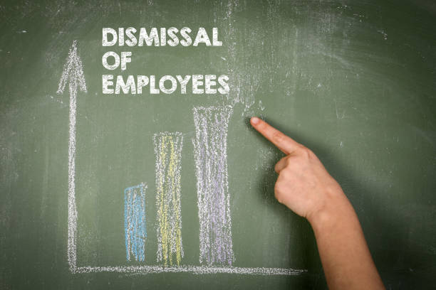istock Dismissal Of Employees. Text and chart on green chalk board 1460738156