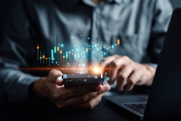 istock Business woman pointing graph discussion and analysis data charts and graphs with her partnership business in office workplace, Business people gather to analyze marketing and investment information. 1460738489