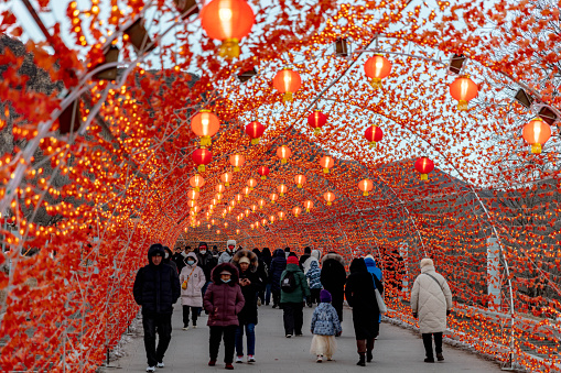 Lanterns are arranged during the Spring Festival at Longqing Gorge in Yanqing, Beijing, and many tourists and shops