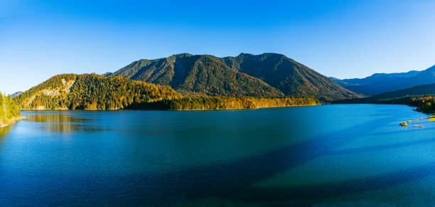 istock Beautiful view of a lake surrounded by mountains 1460740358