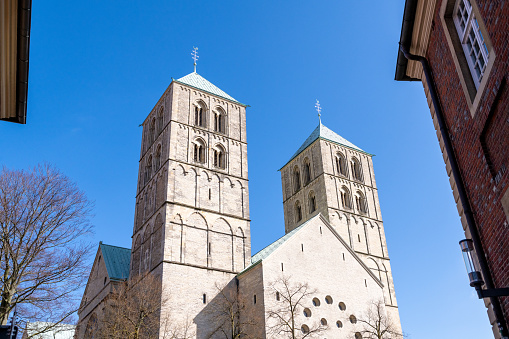 A low angle shot of St. Paul's Cathedral in Munster, Germany under a blue sky