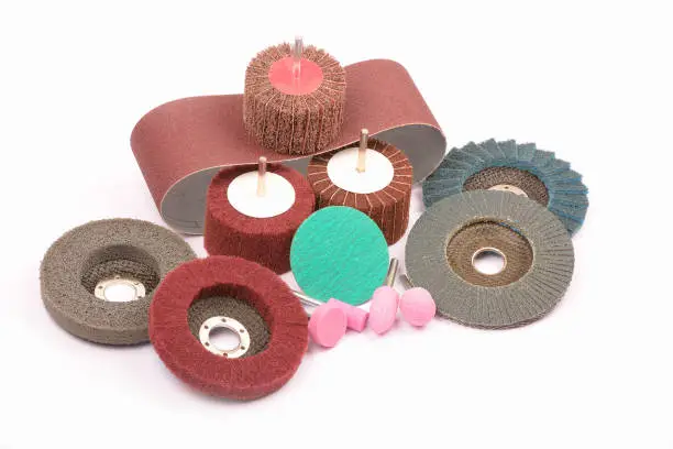 A closeup shot of abrasive wheels isolated on a white background