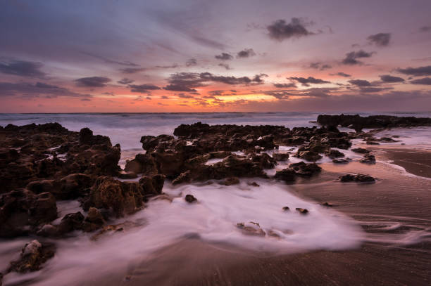 istock Stunning sunset scenery over the seascape and rocky beach 1460741795