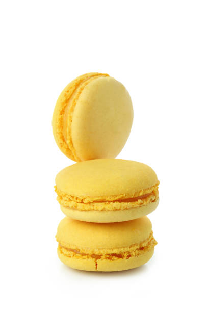 istock Yellow tasty macaroons isolated on white background 1460747772