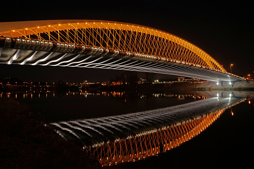 New Futuristic Troja Bridge (Trojsky Most) night view with lights, famous landmark in Prague, Czech Republic