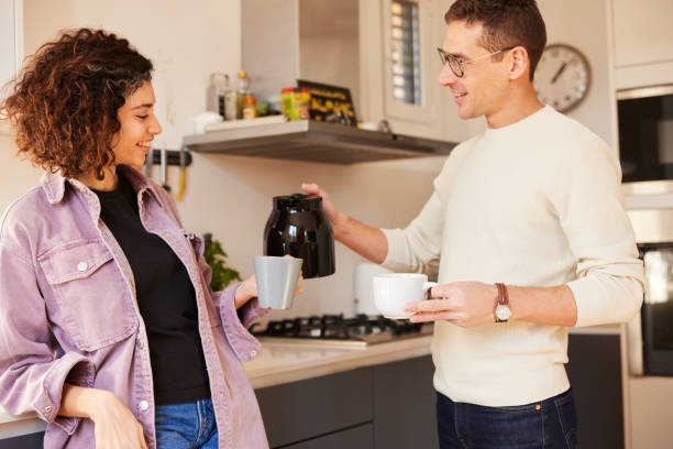istock Relaxed couple in modern apartment over coffee 1460748180